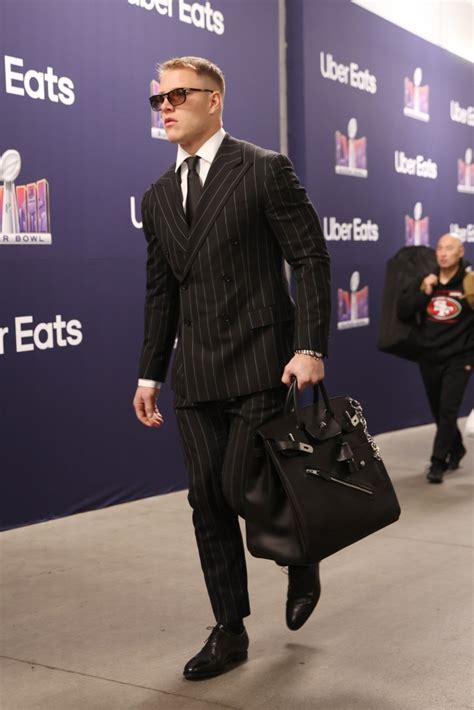 Christian McCaffrey carries edgy K Hermès bag to 2024 